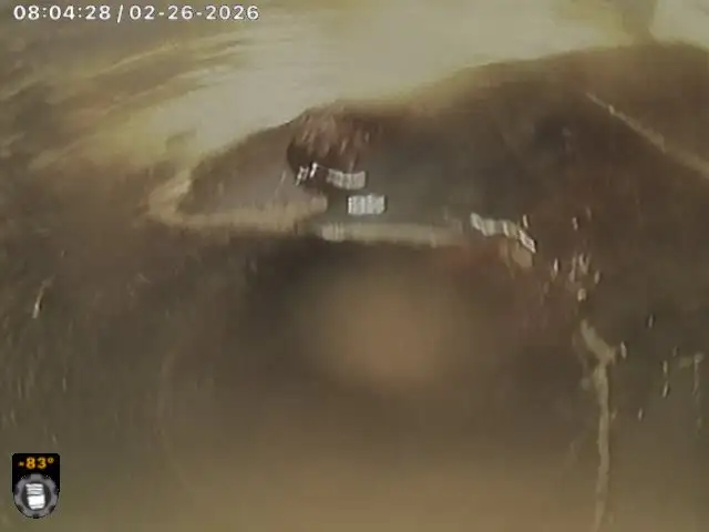 CCTV still from the Mullaloo job: the broken junction at the sewer inspection shaft, with cracked pipe wall and debris around the opening.